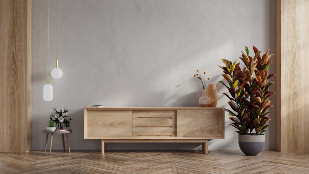 uma imagem minimalista simulando um ambiente de uma casa sustentável com um móvel feito em madeira e outras decorações ao lado